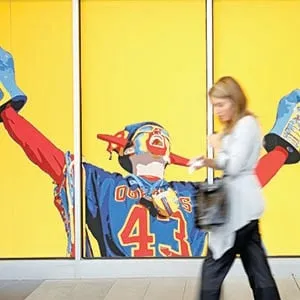 QUEEN'S UNIVERSITY - September 28, 2010 - A mural of a cheering fan greets a passerby at the Queen's Centre which houses the campus's athletics and recreational facilities at Queen's University in Kingston. (Photograph by Yvonne Berg)
