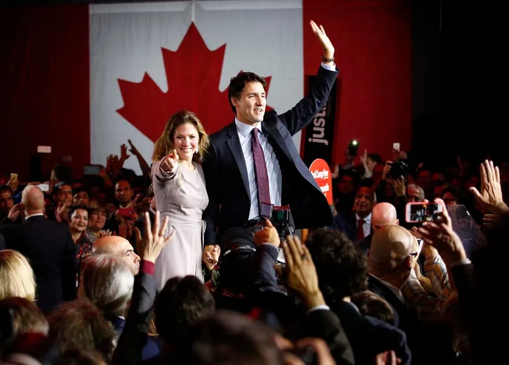 Liberal Party leader Justin Trudeau waves while accompanied by his wife Sophie Gregoire as he gives his victory speech after Canada's federal election in Montreal, Quebec, October 19, 2015. (Jim Young/Reuters)
