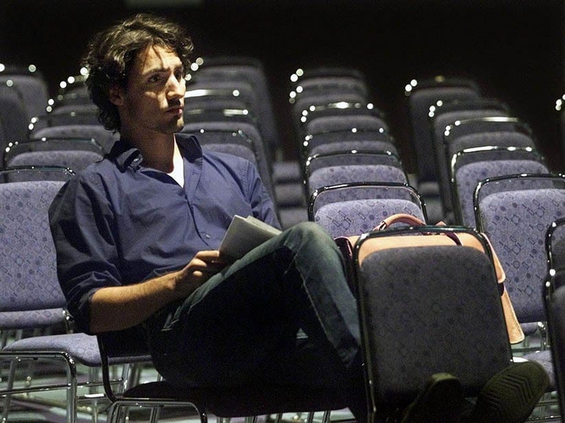 Justin Trudeau, son of former Prime Minister Pierre Trudeau, works on his notes before a news conference in Montreal Wednesday Aug. 28, 2002. Trudeau is chairing a workshop on youth and information technology at the World Computer Congerss in Montreal. (Ryan Remiorz/CP)