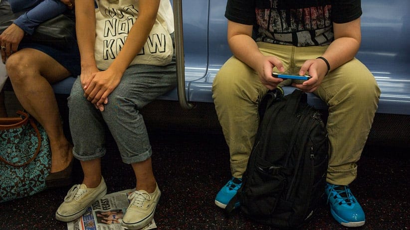 A young man plays a video game September 4, 2014 while riding the subway in the Manhattan borough of New York. (Robert Nickelsberg/Getty Images)