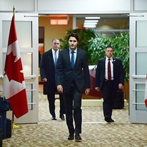 Canadian Prime Minister Justin Trudeau arrives to address the media on the terrorist attacks in Paris prior to his departure for the G20 and APEC summits from Ottawa, Friday November 13, 2015. Trudeau says Canada has offered all the support it can to France following Friday's attacks in Paris. (Sean Kilpatrick/CP)