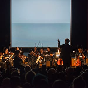 The Met Museum presents "Wave Movements" with the New York Philharmonic performing US Premiere of new work by Bryce Dessner and Richard Reed Parry and film by Hiroshi Sugimoto at the Grace Rainey Rogers Auditorium on November 6, 2015. (Stephanie Berger)