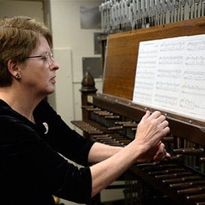 Dominion Carillonneur Dr. Andrea McCrady plays the Peace Tower Carillon on Parliament Hill in Ottawa on Friday, December 13, 2013. McCrady, who was named the Dominion Carillonneur in 2008, plays the Peace Tower Carillon every weekday at noon and on request. (Sean Kilpatrick/CP)