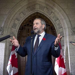 FILE -- NDP Leader Tom Mulcair speaks to reporters in the foyer on Parliament Hill, shortly after addressing his caucus, on Wednesday, Nov. 4, 2015, in Ottawa. THE CANADIAN PRESS/Justin Tang