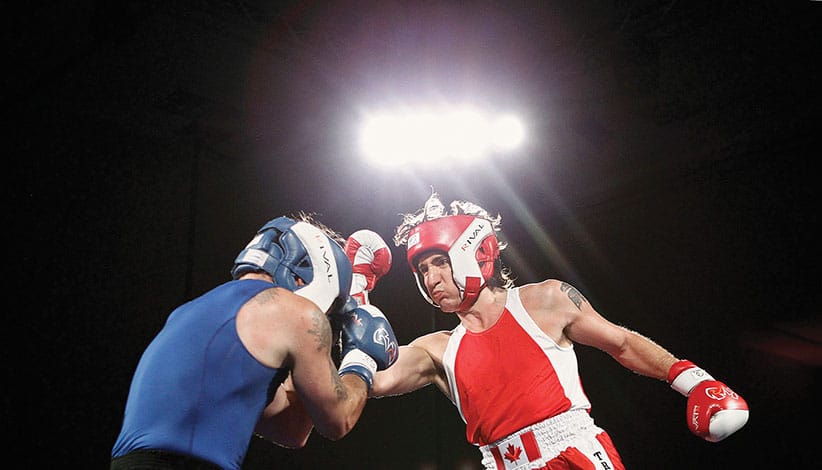 Liberal Member of Parliament Justin Trudeau (R) and Conservative Senator Patrick Brazeau fight during their charity boxing match in Ottawa March 31, 2012. REUTERS/Chris Wattie (CANADA - Tags: SPORT BOXING POLITICS)