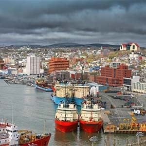 Storm clouds form over the city of St. John's and St. John's busy harbour. (V. J. Matthew/Shutterstock)
