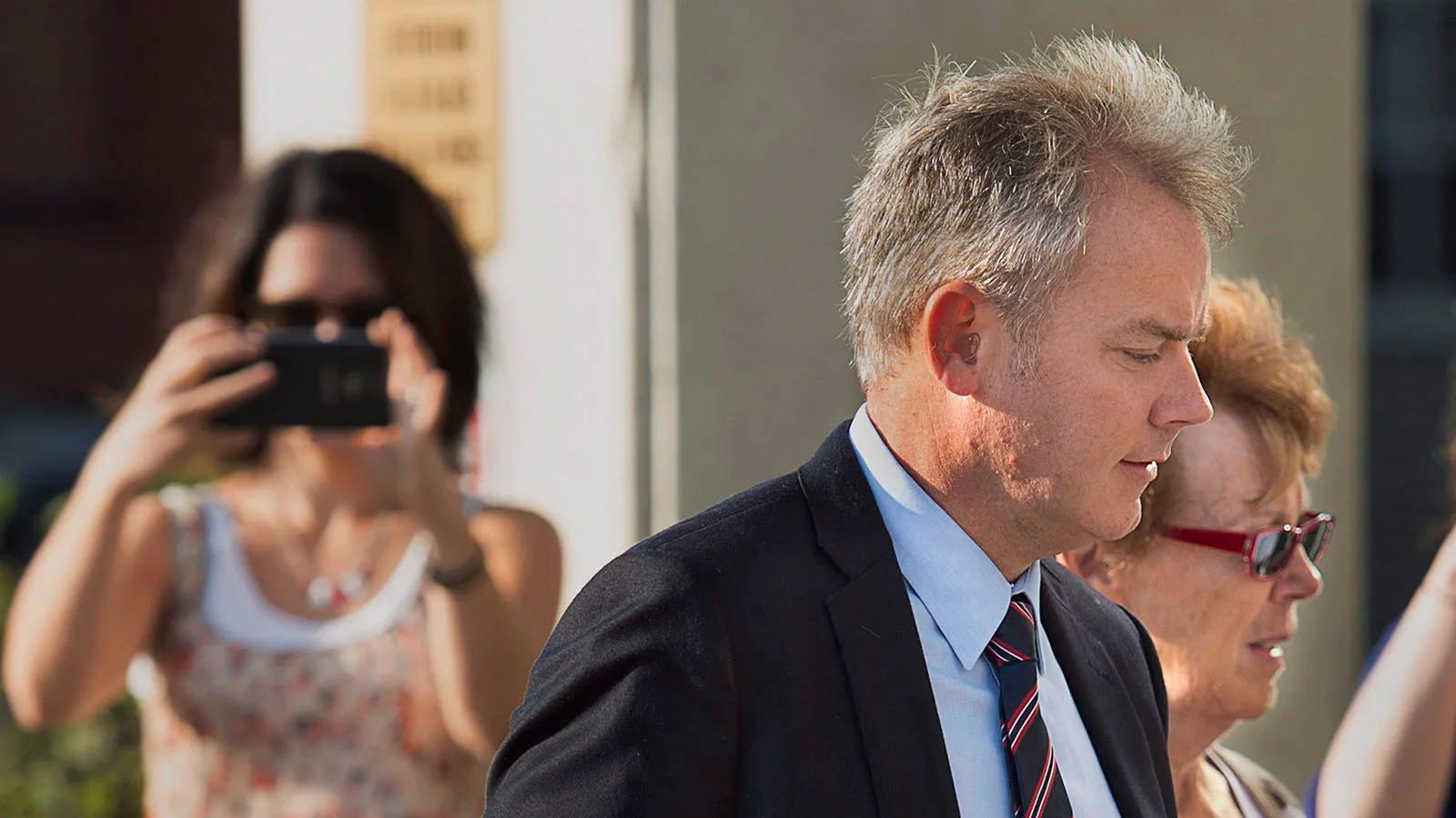 Dennis Oland, accompanied by his mother Constance Oland, arrives for the start of his trial in Saint John, N.B. on Wednesday, Sept. 16, 2015. Oland is charged with second degree murder in the death of his father. Richard Oland, 69, was found dead in his Saint John office on July 7, 2011. (Andrew Vaughan/CP)