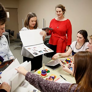 Students learn about the CEBRIC program from Meaghan Shaver, coordinator and professor of the Autism and Behavioural Science Program at St. Lawrence College, in Kingston November 3, 2015. (Photograph by Blair Gable)