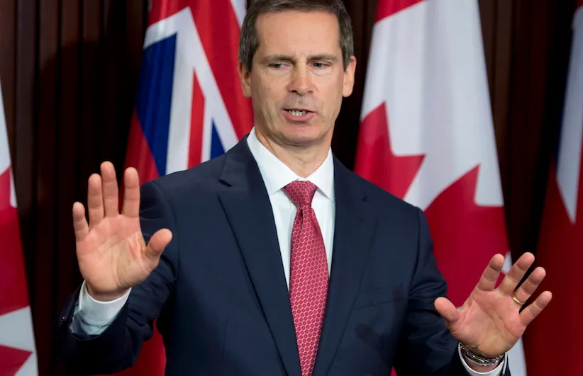 Former Ontario premier Dalton McGuinty answers media questions after appearing before the Special Committee on Justice Policy at the Ontario Legislature in Toronto on Tuesday May 7, 2012. THE CANADIAN PRESS/Frank Gunn