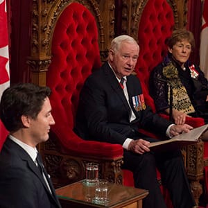 Prime Minister Justin Trudeau and Sharon Johnston listen as Governor General David Johnston delivers the speech from the throne in the Senate Chamber on Parliament Hill in Ottawa, Friday December 4, 2015. THE CANADIAN PRESS/Sean Kilpatrick