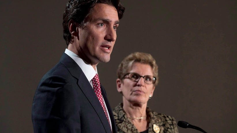 Liberal Leader Justin Trudeau and Ontario Premier Kathleen Wynne take part in a joint news conference in Ottawa, Thursday, January 29, 2015 ahead of a meeting of Canadian premiers. Wynne says she would drop the idea of creating a provincial pension plan if Trudeau becomes the next prime minister. THE CANADIAN PRESS/Adrian Wyld