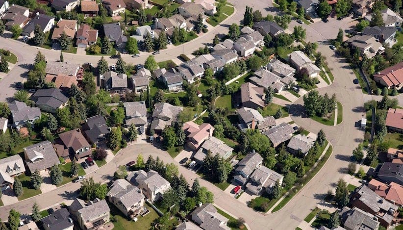 An aerial view of housing is shown in Calgary on June 22, 2013. The Canadian Real Estate Association expects average house prices in Alberta, Saskatchewan and Newfoundland and Labrador to fall next year because of the downturn in the oil industry.The association is estimating Alberta's average housing price will fall in 2016 by 2.5 per cent. THE CANADIAN PRESS/Jonathan Hayward