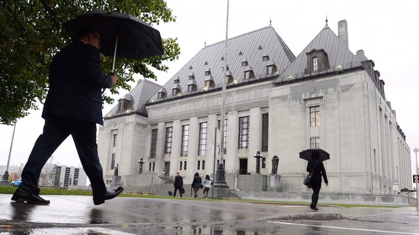 The Supreme Court of Canada building is pictured, in Ottawa, on October 15, 2014. The Trudeau government appears to be in no hurry to grapple with the explosive issue of doctor-assisted dying, even as it prepares to urge the Supreme Court next week to give it more time to craft a new law on the matter. THE CANADIAN PRESS/Sean Kilpatrick