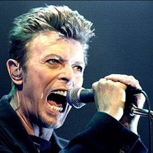 British Pop Star David Bowie screams into the microphone as he performs on stage during his concert in Vienna. (Leonhard Foeger/Reuters)