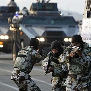 Saudi special security forces show their skills during a military parade at a base near Mount Arafat, southeast of the holy city of Mecca, on November 22, 2009. Saudi Arabia's Interior Minister Prince Nayef bin Abdul Aziz said the kingdom hopes not to have to "resort to force" to maintain security for the hajj, in a reference to worries Iranian pilgrims may demonstrate. Hundreds of thousands of pilgrims from across the globe have gathered in the country to perform the pilgrimage in the holy Muslim cities of Mecca and Medina. (Mahmud Hams/AFP/Getty Images)