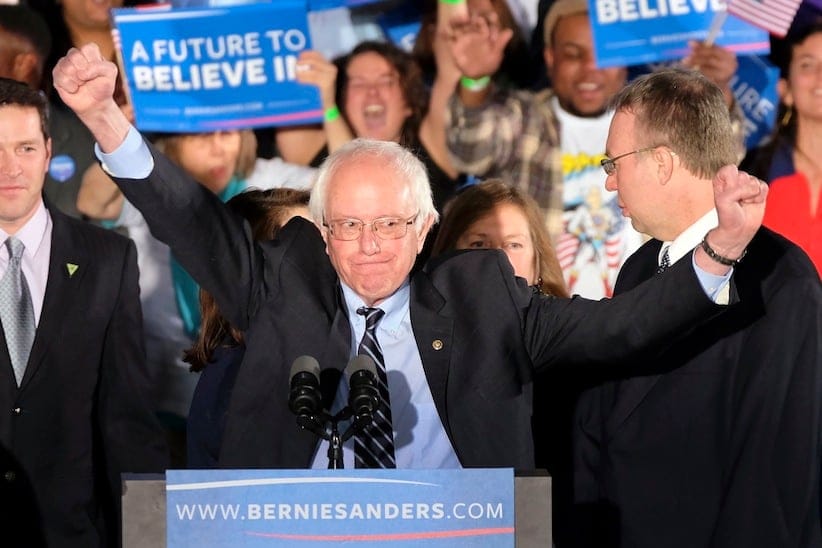 Democratic presidential candidate, Sen. Bernie Sanders, I-Vt., reacts to the cheering crowd at his primary night rally Tuesday, Feb. 9, 2016, in Manchester, N.H. (AP Photo/J. David Ake)