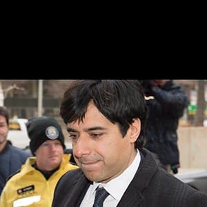 Jian Ghomeshi walks in front of protesters as he arrives at a Toronto courthouse with his lawyer Marie Henein (left) for the third day of his trial on Tuesday, Feb. 2, 2016. THE CANADIAN PRESS/Frank Gunn