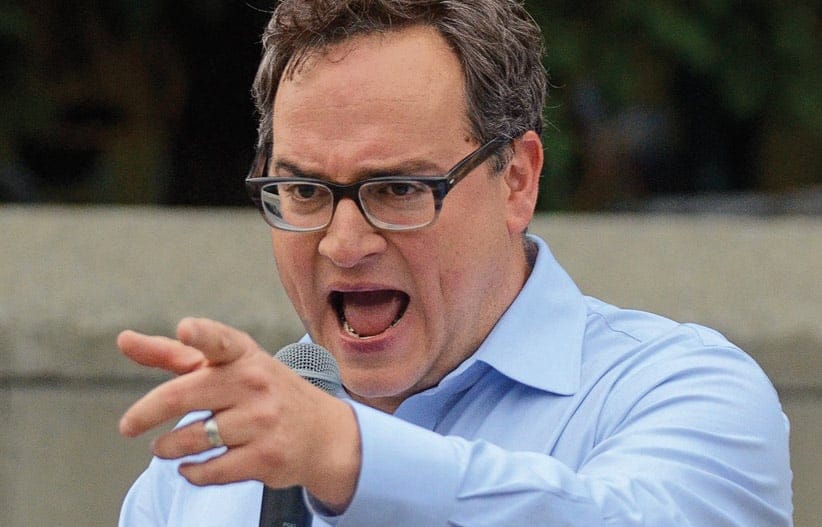 Sun News Network columnist and host of The Source, Ezra Levant speaks to a crowd of a few hundred at a Calgary for Israel rally at city hall in downtown Calgary, Alta. on Thursday July 31, 2014. The event was being held to show solidarity with the Israeli people while condemning pro-Palestinian supporters who attacked members of a Jewish family during what he called a pro-Hamas rally two weeks ago. Stuart Dryden/Calgary Sun/QMI Agency