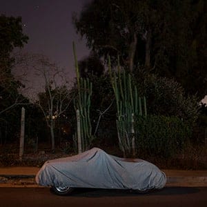 Covered up: ‘My cars are loners,’ writes Ludwig in the introduction to Sleeping Cars, a large-format photo book to be published in the spring. ‘I’ve spied on them in their nightgowns. I’ve watched some sleep in the nude; some take afternoon naps and a few lucky ones get to sleep together.’ (Gerd Ludwig/National Geographic)
