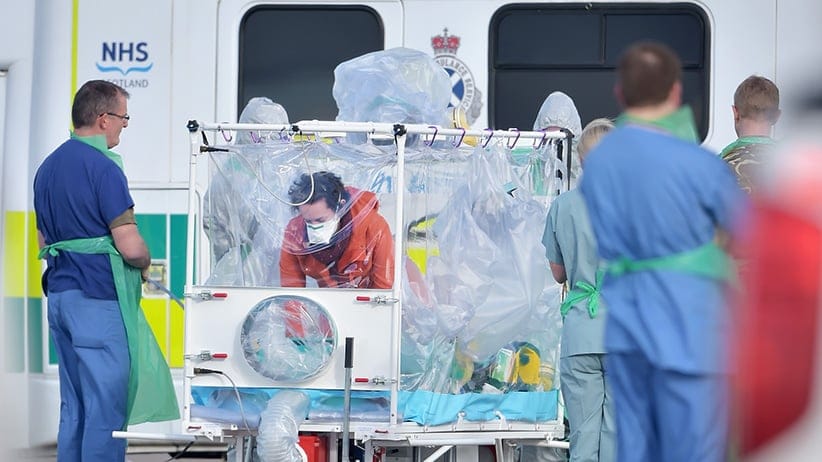 Pauline Cafferkey enters an isolation tent before boarding a RAF Hercules at Glasgow Airport on February 23,2016 in Glasgow,Scotland. The RAFHercules aircraft is transporting her to London where she will be treated at the Royal Free Hospital for suspicion of Ebola for the third time. (Jeff J Mitchell/Getty Images)