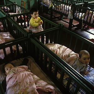 CHINA - MARCH 11: A Chinese child at orphanage in Shangai, China on March 11, 1994. (Raphael Gaillarde/Gamma-Rapho/Getty Images)