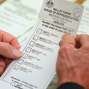 PERTH, AUSTRALIA - AUGUST 25: A ballot paper is scrutinised as the counting of absentee and postal votes for the marginal seat of Hasluck in Western Australia begins on August 25, 2010 in Perth, Australia. The 4,500 postal votes are considered key for the WA seat as Liberal Party candidate Ken Wyatt currently leads incumbent Australian Labor Party candidate Sharryn Jackson by less than 400 votes as Australia waits for a result in the hung Parliament situation following the Federal Election on August 21. (Paul Kane/Getty Images)