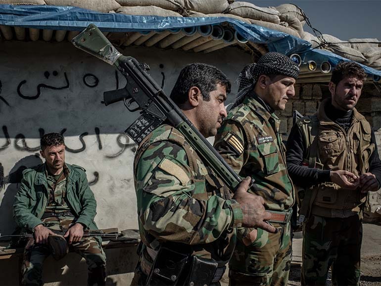 Peshmerga fighters at a frontline southwest of Kirkuk, Iraq. Many Peshmerga fighting ISIS haven’t been paid a salary over four months due to the economic crisis in Kurdistan. (Photograph by Cengiz Yar)