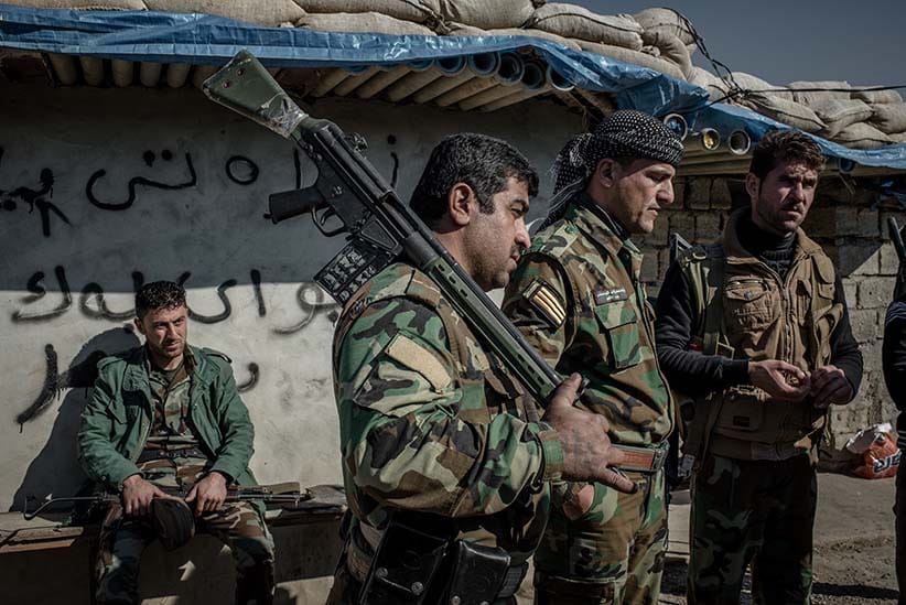 Peshmerga fighters at a frontline southwest of Kirkuk, Iraq. Many Peshmerga fighting ISIS haven’t been paid a salary over four months due to the economic crisis in Kurdistan. (Photograph by Cengiz Yar)