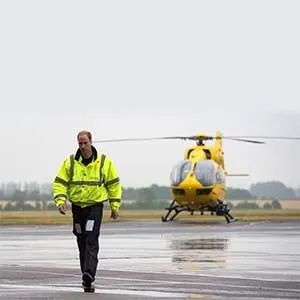 CAMBRIDGE , UNITED KINGDOM - JULY 13: Prince William, The Duke of Cambridge as he begins his new job with the East Anglian Air Ambulance (EAAA) at Cambridge Airport on July 13, 2015 in Cambridge, England. The former RAF search and rescue helicopter pilot will work as a co-pilot transporting patients to hospital from emergencies ranging from road accidents to heart attacks. (Stefan Rousseau/Getty Images)