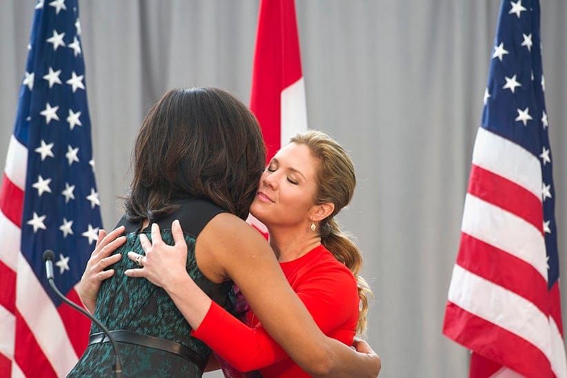 First lady Michelle Obama and Sophie Grégoire-Trudeau, wife of Canadian Prime Minister Justin Trudeau, hug while they participate in a program at the U.S. Institute of Peace in Washington, Thursday, March 10, 2016, to highlight Let Girls Learn efforts and raise awareness for global girl's education. (Cliff Owen/AP)