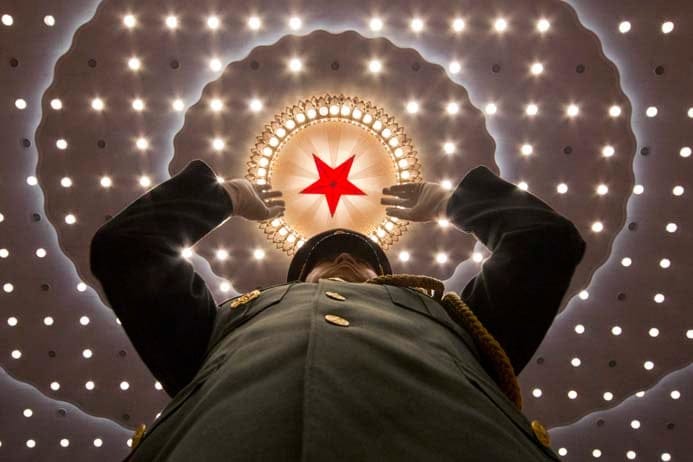 A military band conductor leads the band at the close of the annual National People's Congress held in Beijing's Great Hall of the People on Wednesday, March 16, 2016. (Ng Han Guan/AP)