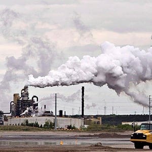 A dump truck works near the Syncrude oil sands extraction facility near the city of Fort McMurray, Alberta on Sunday June 1, 2014. The furore over a New Democrat candidate's remarks about leaving a lot of Alberta's oilsands in the ground is a reflection of how poorly the issue is understood, say energy experts. (Jason Franson/CP)