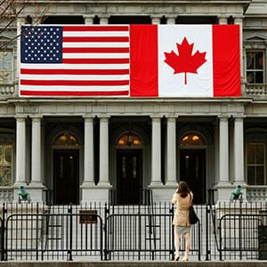 A woman stops to take a photo of the U.S. and Canadian flags placed side-by-side on the Eisenhower Executive Office Building next to the White House in Washington March 8, 2016. Preparations are under way for the official state visit of Canada's Prime Minister Justin Trudeau on Thursday. (Kevin Lamarque/Reuters)