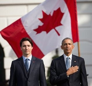 President Barack Obama and Canadian Prime Minister Justin Trudeau, stand for the playing of national anthems during an arrival ceremony on the South Lawn of the White House in Washington, Thursday, March 10, 2016. (AP Photo/Andrew Harnik)