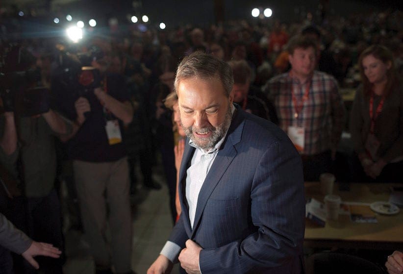 Federal NDP Leader Tom Mulcair makes his way to his seat after his speech during the 2016 NDP Federal Convention in Edmonton Alta, on Sunday, April 10, 2016. (Jason Franson/CP)