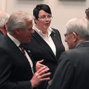 Newfoundland and Labrador Finance Minister Cathy Bennett makes her way past colleagues after presenting the 2016 provincial budget at the House of Assembly in St.John's, Thursday, April 14, 2016. (Paul Daly/CP)