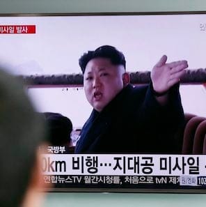 A man watches a TV news program showing a file footage of North Korean leader Kim Jong Un at Seoul Railway Station in Seoul, South Korea, Friday, April 1, 2016. North Korea fired a short-range missile into the sea on Friday, Seoul officials said, hours after the U.S., South Korean and Japanese leaders warned the North it will face tougher sanctions if it continues with provocations. The Korean letters at bottom read: "Analysis, the surface-to-air missile." (AP Photo/Lee Jin-man)