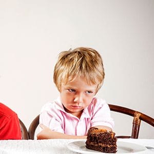 Kid upset over cake. (Chris Fertnig/Getty Images)
