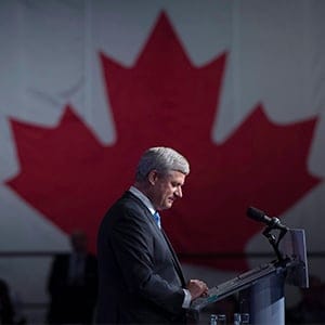 Conservative leader Stephen Harper pauses for a moment as he addresses the crowd on election night in Calgary, Ab. Monday Oct. 19, 2015. (Jonathan Hayward/CP)