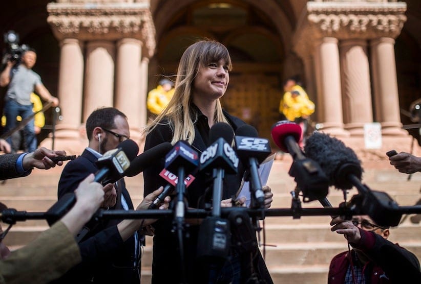 Complainant Kathryn Borel, a former colleague of Jian Ghomeshi who accused him of sexually assaulting her, speaks to the media after she agreed to a peace bond for Ghomeshi in Toronto, Wednesday, May 11, 2016. (Mark Blinch/CP)