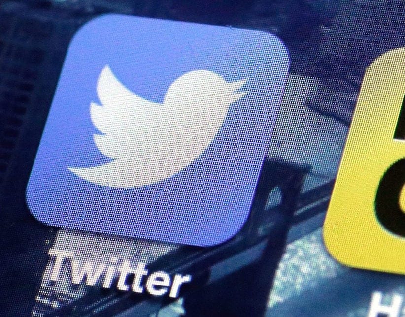 This Friday, Oct. 18, 2013, file photo, shows a Twitter app on an iPhone screen, in New York. (AP Photo/Richard Drew, File)