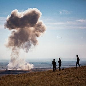 **EDS: RETRANSMISSION OF XNYT17 SENT 11/12/15 TO ADD ADDITIONAL INFORMATION: PESHMERGA ATTACKED ISLAMIC STATE CAR BOMB BEFORE IT COULD REACH ITS TARGET.** A car bomb, from the Islamic State, is blown up by a peshmerga antitank missile before the driver could reach his target, near peshmerga vehicles that had just entered a small village on Highway 47, in Mount Sinjar, Iraq, Nov. 12, 2015. Kurdish-led forces Thursday gained control over a major jihadi supply line between Syria and the Iraqi city of Mosul as part of a broader offensive to reclaim the town of Sinjar. Bryan Denton/The New York Times/Redux