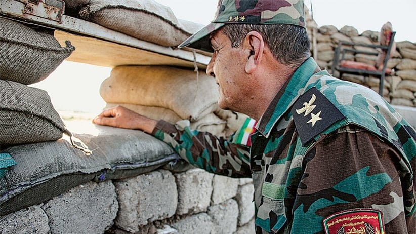 Al Khidhir, Iraq Colonel Abdularrahman Hassan, a commander of the Zeravani forces, keeps an eye on Islamic State positions at the frontlines near Mosul. Canadian special forces stationed in the Kurdistan Region of northern Iraq have focused their training and supply mission on the Zeravani, a security force attached to the Kurdistan Region's Interior Ministry and considered loyal to the Kurdistan Democratic Party, or KDP. Other political groups complain that Canada has played favourites, arming and training forces that have political ties at the expense of Kurdish unity.(Photograph by Adnan R. Khan)
