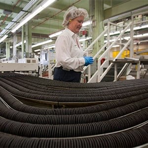 A worker keeps an eye on the cookie production line at the plant that makes all the Oreos for Canada. (Ryan Remiorz/CP)