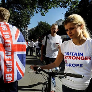 A vote remain supporter walks past a vote leave supporter outside Downing Street in London, Britain June 24, 2016 after Britain voted to leave the European Union. (Kevin Coombs/Reuters)