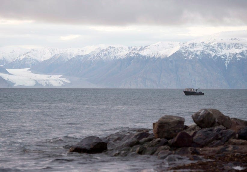 A small fishing boat sits at anchor off the hamlet of Pond Inlet, Nunavut Saturday August 23, 2014. (Adrian Wyld/CP)