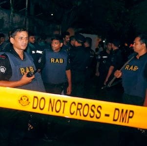 Bangladeshi security officers cordon off an area after heavily armed militants attacked a restaurant in Bangladesh's diplomatic zone on Friday night, in Dhaka, Bangladesh, Saturday, July 2, 2016. Bangladeshi forces stormed the popular Holey Artisan Bakery in Dhaka's Gulshan area to end a hostage-taking early Saturday. (AP Photo)