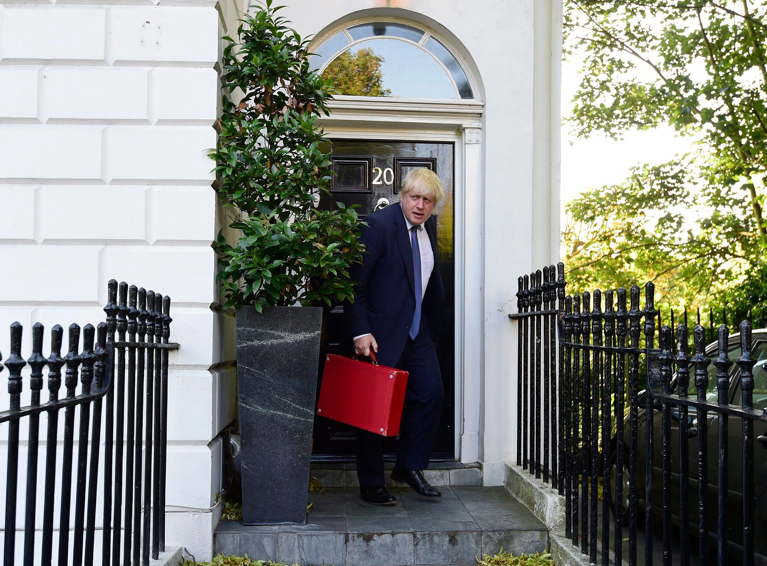 Newly appointed British Foreign Secretary Boris Johnson leaves his home in north London, as new Prime Minister Theresa May prepared to put the finishing touches to her top team, Thursday July 14, 2016. (Lauren Hurley/PA via AP)