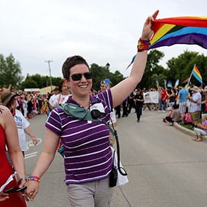 Michelle McHale, Karen Phillips and Chris Plett lead thousands of people during the first Pride march in Steinbach, Manitoba, Saturday, July 9, 2016. (Trevor Hagan/CP)