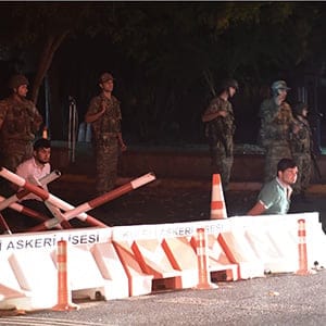 Turkish security officers detain unknown individuals on the side of the road on July 15, 2016 in Istanbul, during a security shutdown of the Bosphorus Bridge. Turkish Prime Minister Binali Yildirim on July 15 denounced what he said was an "illegal attempt" by elements in the military after bridges were partially shut down in Istanbul and jets flew low over Ankara. "We are working on the possibility of an attempt. We will not allow this attempt," he told NTV television by telephone, without expanding on the nature of the move but saying it was by a group in the Turkish military. (BULENT KILIC/AFP/Getty Images)